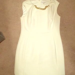 A white fitted Calvin Klein dress